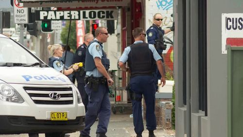 Police outside a property in Fairy Meadow, four kilometres outside of Wollongong's city centre.