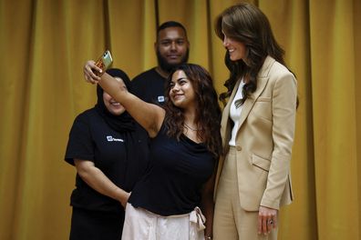 Kate, Princess of Wales poses for a selfie during her visit at Streets of Growth in east London, Tuesday, September 19, 2023.  