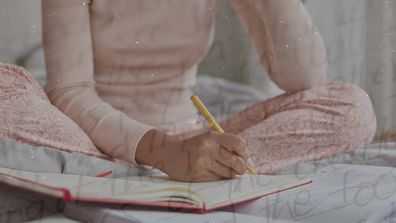 Girl writing in her diary