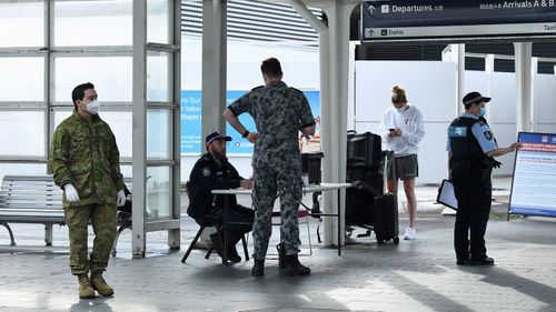 Passengers arrive at Sydney International Airport from Los Angeles off the United Airlines flight UA839 that arrived just after 6am on October 1.