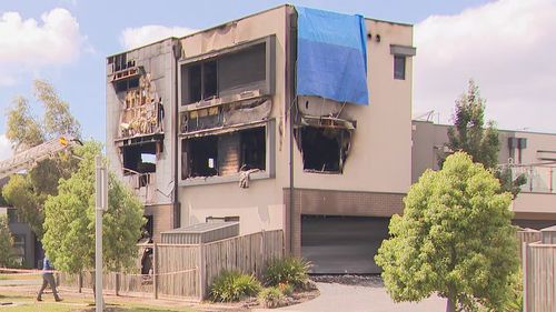 A woman has been killed in a suspicious house fire in Melbourne, which police say may have been a case of mistaken identity.