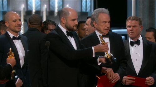 Brian Cullinan (right) reacts as Best Picture is incorrectly awarded. (9NEWS)