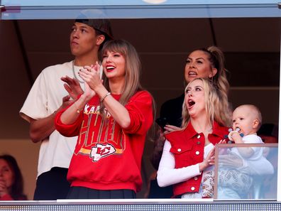 KANSAS CITY, MISSOURI - OCTOBER 22: Taylor Swift and Brittany Mahomes react during a game between the Los Angeles Chargers and Kansas City Chiefs at GEHA Field at Arrowhead Stadium on October 22, 2023 in Kansas City, Missouri. (Photo by Jamie Squire/Getty Images)