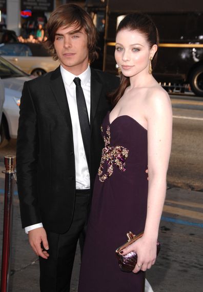 Zac Efron and Michelle Trachtenberg arrive at the Los Angeles premiere of 17 Again in 2009.