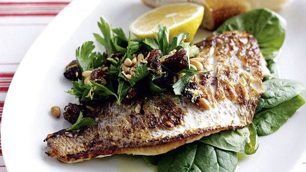 Pan-fried fish with lemon and spinach salad. Image: Australian Women's Weekly