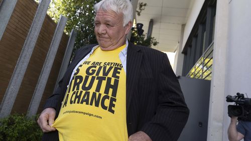 Following a mid-morning break today, moments after the jury was brought into the court room, a protester stood up in the public gallery and addressed Justice Christopher Beale."How can you be a judge?" the man, wearing a yellow T-shirt with "all we are saying is give truth a chance" written on it, said.