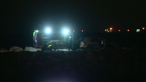 Emergency crews attend the scene of the accident last night.