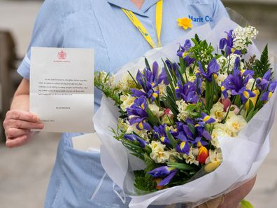 General view of flowers from Queen Elizabeth II to staff at St Bartholomew's Hospital, London, on the anniversary of the first national lockdown to prevent the spread of coronavirus. (Photo: March 23, 2021)