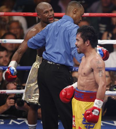 The referee warned Mayweather about use of the elbows.