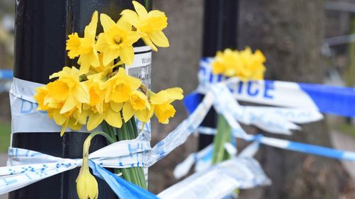 Flowers at the spot in Salisbury  where the former double agent and his daughter were found seriously ill on a bench