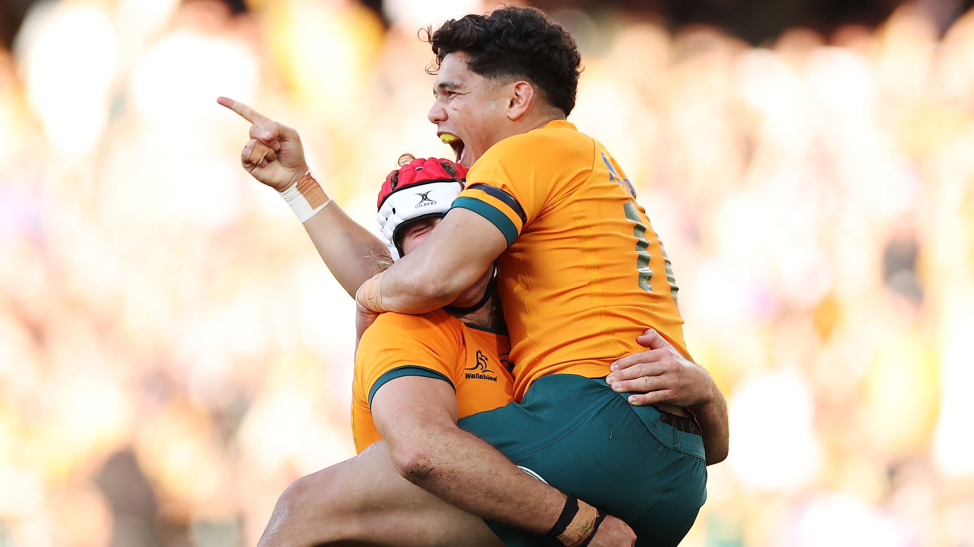 Noah Lolesio of the Wallabies celebrates with try-scorer Fraser McReight.