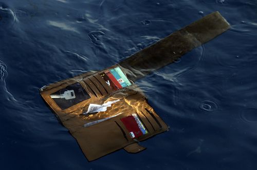 The wallet of a deceased passenger floats near the wreckage of Lion Air flight 610.