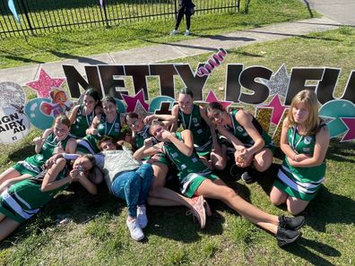 Helen Ryan coaching with her Division 5 under 15's netball team for Randwick Rugby Netball Club on their grand final day.
