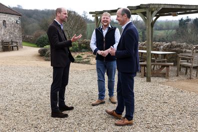 PENSFORD, ENGLAND - MARCH 26: Prince William, Prince of Wales (L) speaks with Clarkson's Farm stars Kaleb Cooper (C) and Charlie Ireland (R) during an event for sixty of the Duchy of Cornwall's next generation of farming tenants, on March 26, 2025 in Pensford, England (Photo Darren Staples - WPA Pool/Getty Images)