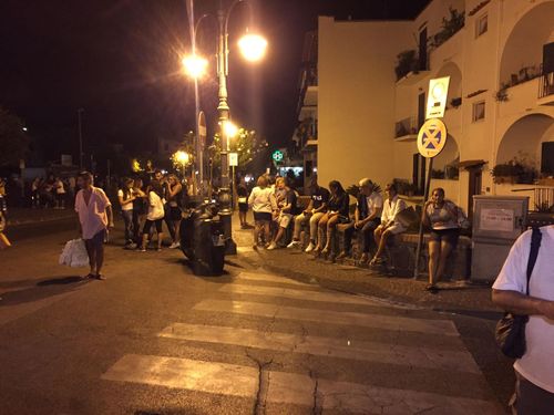 People wait in the street after a 3.6 magnitude earthquake at Ischia island. (AAP)