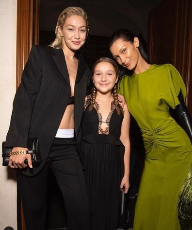 Harper Beckham with Gigi and Bella Hadid taken at Paris Fashion Week.