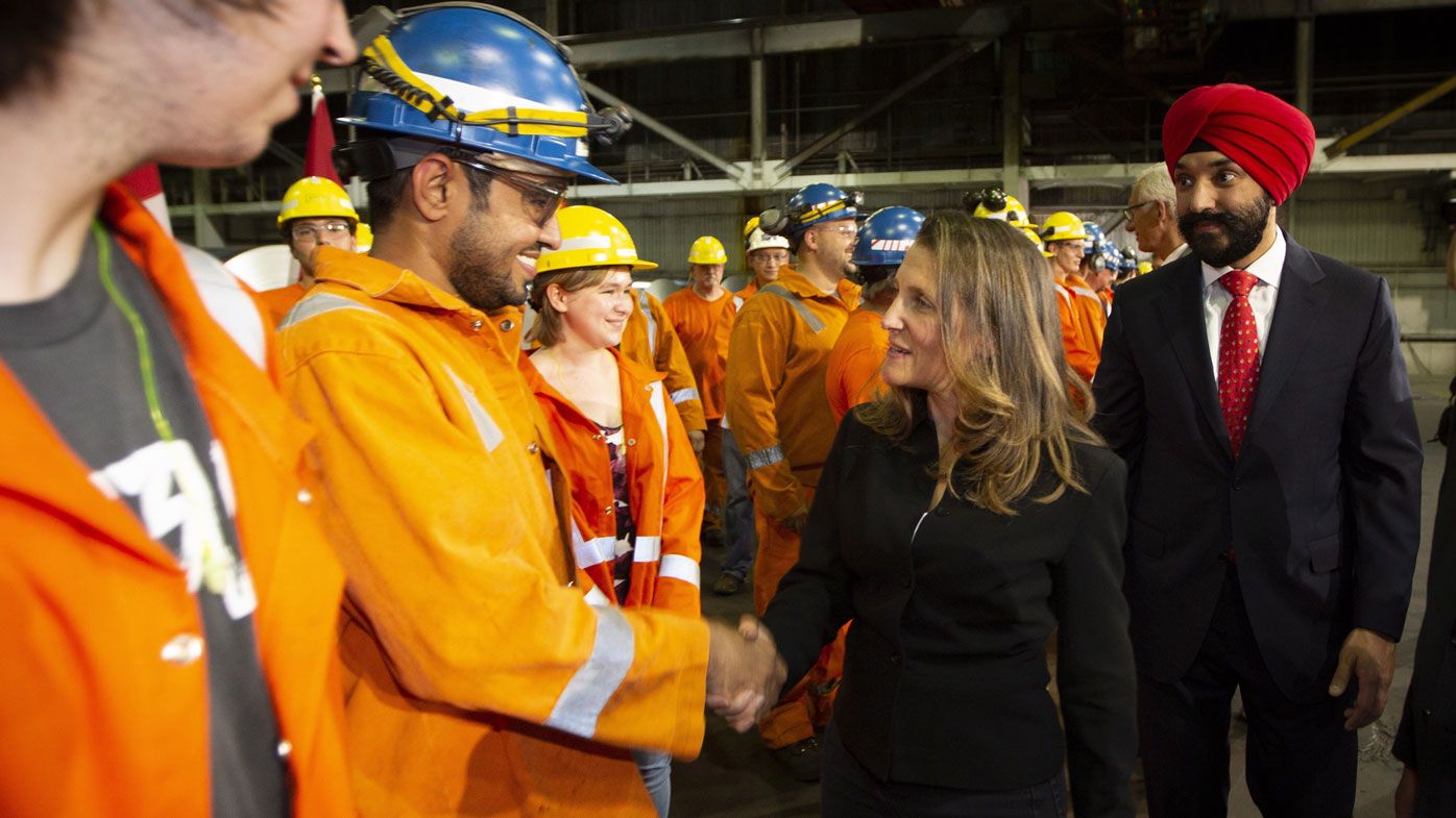 Canadian Foreign Minister Chrystia Freeland meets with steel workers. (AAP)