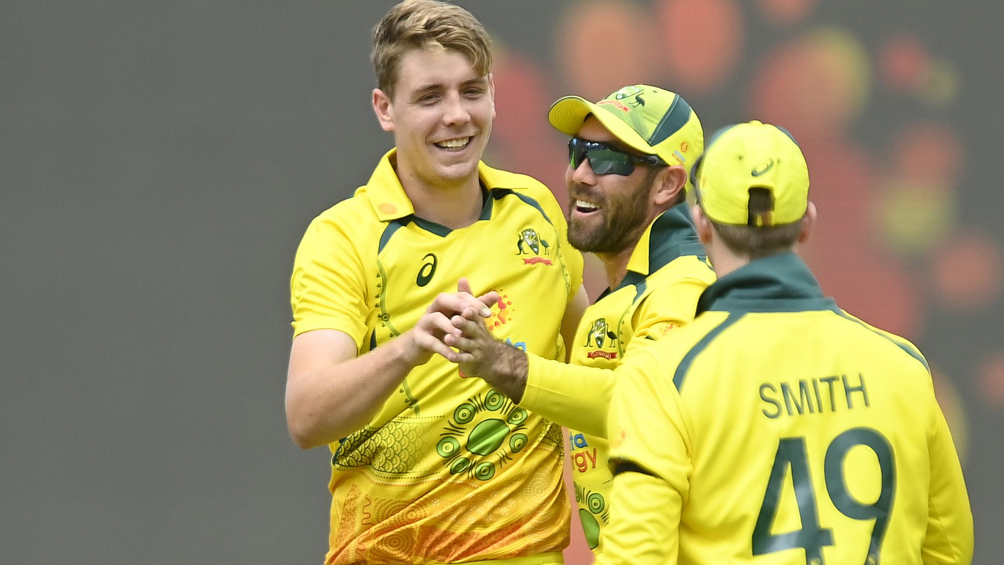 Cameron Green of Australia celebrates after taking the wicket of Sikandar Raza of Zimbabwe.