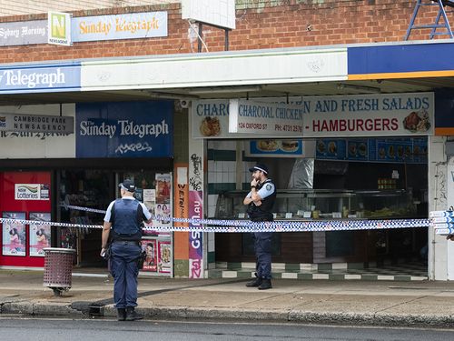 Two bodies have been found on Oxford St, Cambridge. Possible family members  of the victims are escorted by the police.November 30, 2024. Photo: Rhett Wyman / SMH