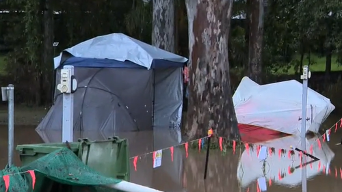 Tents were swallowed by muddy brown water at the Gold Coast site.