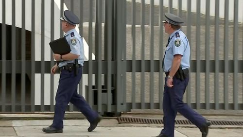 NSW Police at the Sydney home of Don Harwin this afternoon.