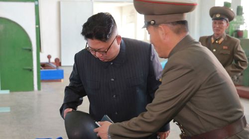 North Korea's state media released photos Wednesday that appear to show the designs of one or possibly two new missiles. (AAP)