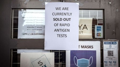 A sign at a pharmacy in Victoria indicates it has sold out of rapid antigen tests.