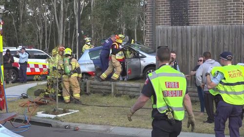 A woman has been charged after her car hit a man and crashed into a house in Schofields, Sydney.