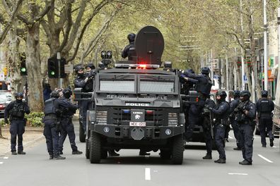 MELBOURNE, AUSTRALIA - SEPTEMBER 22: The Critical Incident Response Team (CIRT) of the Victorian Police are seen along King Street on September 22, 2021 in Melbourne, Australia. Protests started on Monday over new COVID-19 vaccine requirements for construction workers but  turned into larger and at times violent demonstrations against lockdown restrictions in general. Melbourne is currently subject to COVID-19 lockdown restrictions, with people only permitted to leave home for essential reasons.