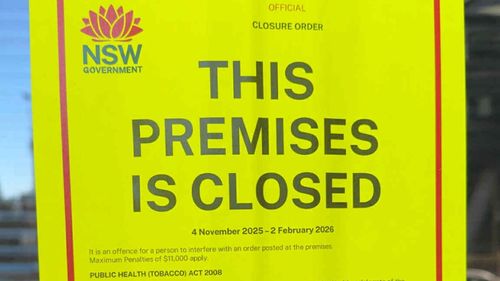 A notice on the front of a St Leonards, Sydney tobacco store after its closure by the NSW government. It is suspected of being involved in the trade of illicit tobacco.