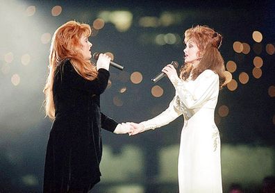 Wynonna Judd, left, and her mother Naomi Judd, of The Judds, perform during the halftime show at Super Bowl XXVIII in Atlanta in 1994.