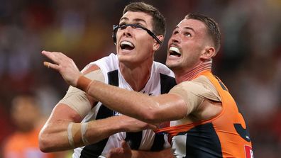 Mason Cox of the Magpies and Kieren Briggs of the Giants contest the ball during the AFL Opening Round match between Greater Western Sydney Giants and Collingwood Magpies at GIANTS Stadium, on March 09, 2024, in Sydney, Australia. (Photo by Cameron Spencer/Getty Images)