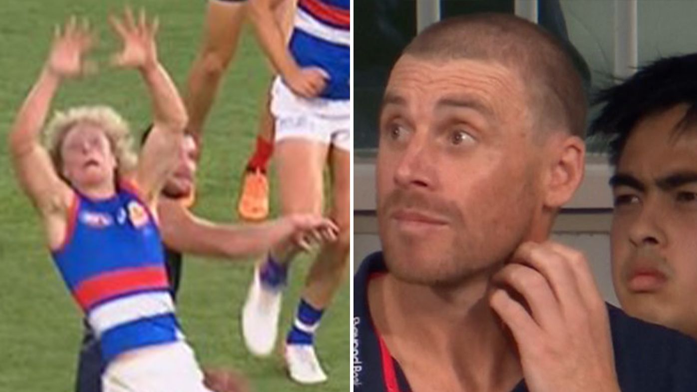 MCG siren drama sours grand final rematch as Demons grind through Dogs in a belter