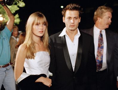 Actor Johnny Depp and his girlfriend supermodel Kate Moss are seen arriving for the premiere of Depp's film "Don Juan DeMarco," in Beverly Hills, Calif., April 3, 1995. 