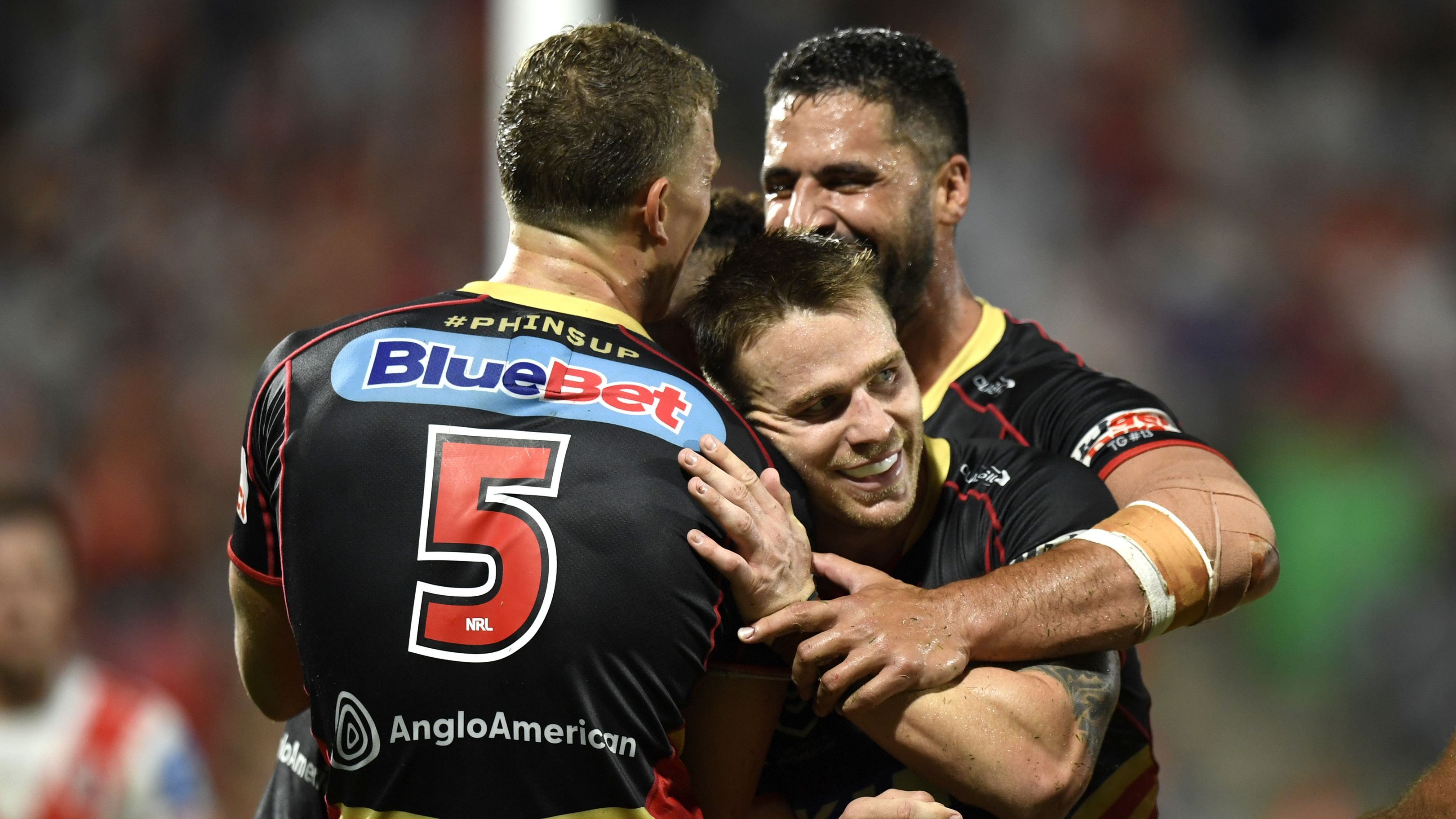 The Dolphins celebrating a massive win over the Dragons in Redcliffe.