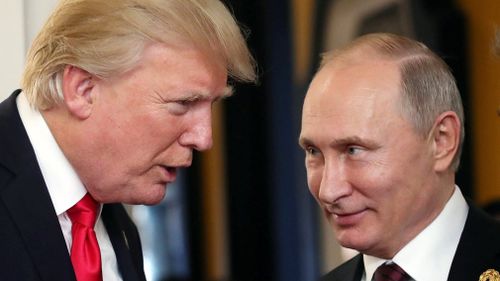 Russian President Vladimir Putin (R) and US President Donald J. Trump (L) talk at the break of a leader's meeting at the 25th Asia-Pacific Economic Cooperation (APEC) summit in Da Nang, Vietnam. (AAP)