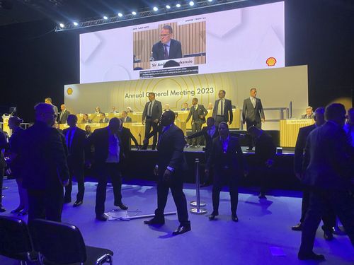 Security after protesters tried to storm the stage at the Excel centre in east London during oil giant Shell's annual general meeting in London, Tuesday, May 23, 2023. 