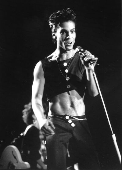 Prince's showcases his svelte physique - the result of a frenetic stage show and a vegan diet - in a crop top circa 1986.