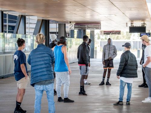 Two groups of teens argue at Wyndham Vale station.