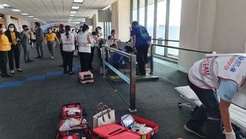 A medical team is deployed to save a woman after her leg gets caught in a moving walkway at Don Mueang International Airport.