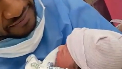 Usher and new son Sire snapped together.