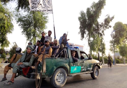 Taliban fighters patrol inside the city of Kandahar, southwest Afghanistan.