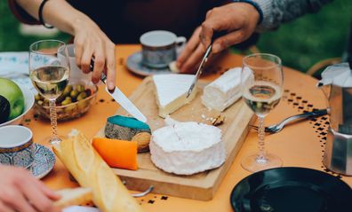 French brunch, with wine, brie cheese, blue cheese and baguettes cheese board