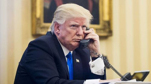 Donald Trump on the phone to Malcolm Turnbull. (EPA)