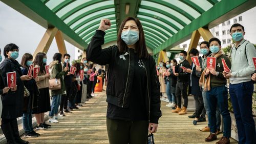 Medical workers hold a strike near Queen Mary Hospital to demand the government shut the city's border with China to reduce the spread of the coronavirus.