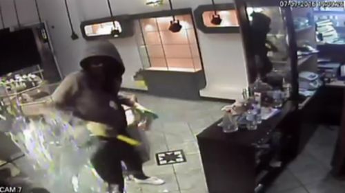 CCTV captured Mawien robbing a jewellery store. (9NEWS)