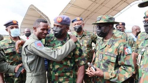 The pilot on board the flight, Abayomi Dairo, is greeted by the Chief of Air Staff, Air Marshal Oladayo Amao.