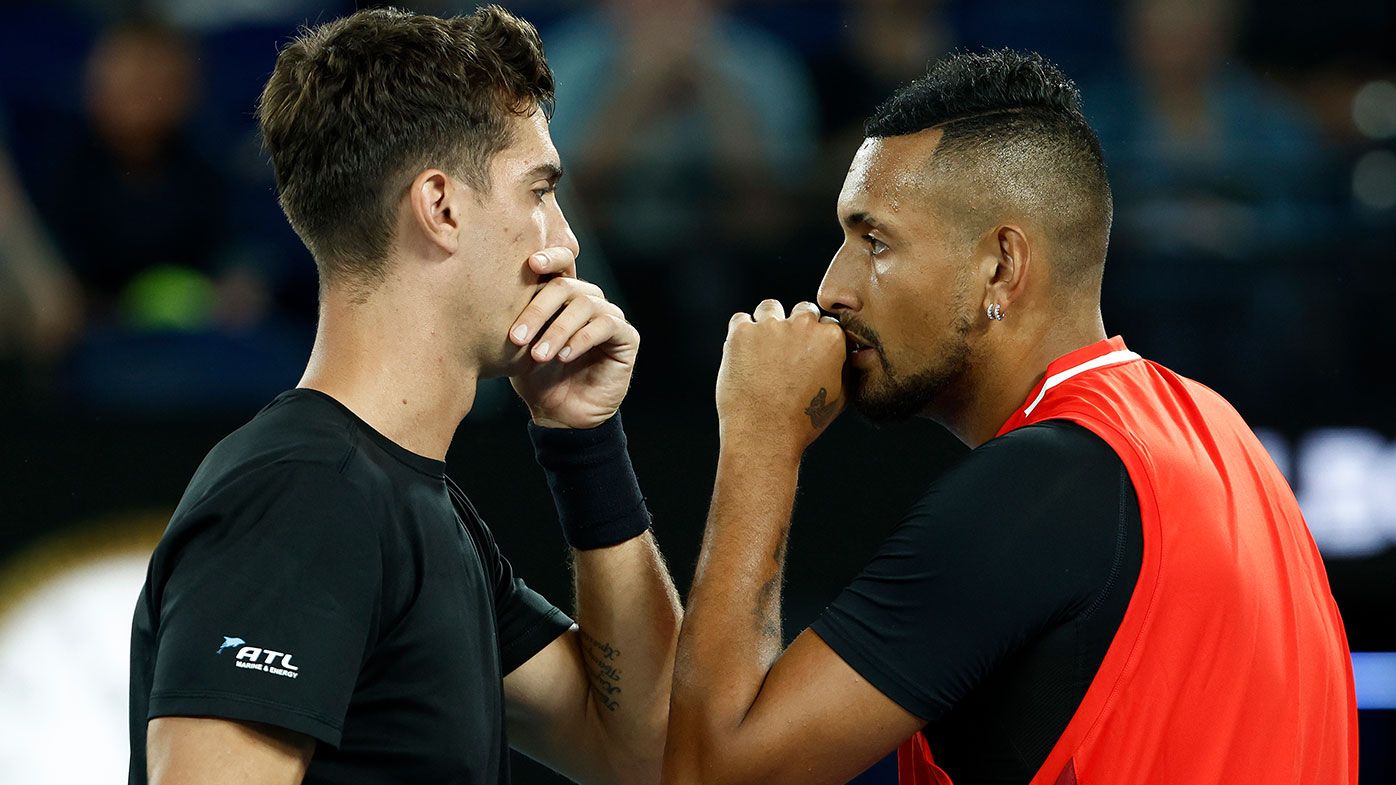 Nick Kyrgios (R) of Australia and Thanasi Kokkinakis of Australia discuss tactics in their Men&#x27;s Doubles Final match 