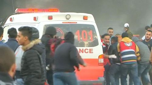 A Red Crescent marked ambulance appeared to run somebody over in heavy crowds (Supplied)