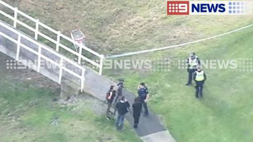 Police speak with possible witnesses following the stabbing. (9NEWS)